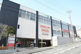 千里山ロイヤルマンション２番街Ｄ棟(ユニカムドラッグ西泉丘薬局)