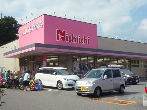 宝梅園1号棟(ニシイチドラッグ健康館小林駅前店)